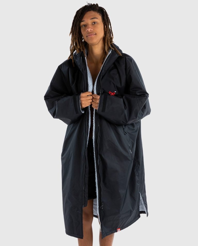 Model wearing a black dryrobe Advance Long Sleeve with grey fleece lining