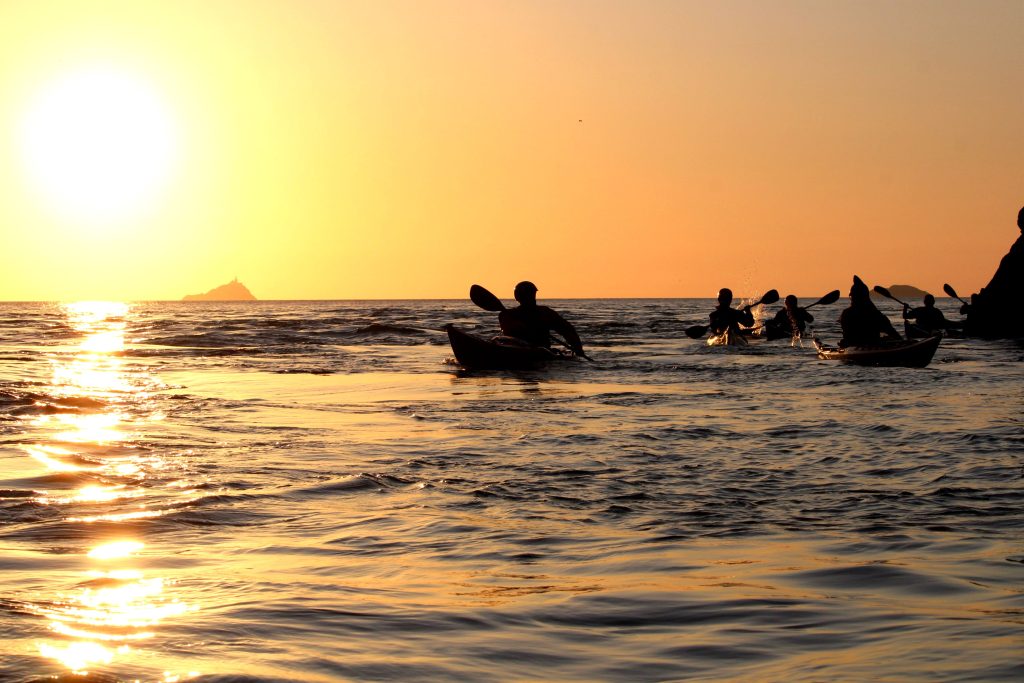 A group of sea kayakers developing their skills on the Pembrokeshire coast