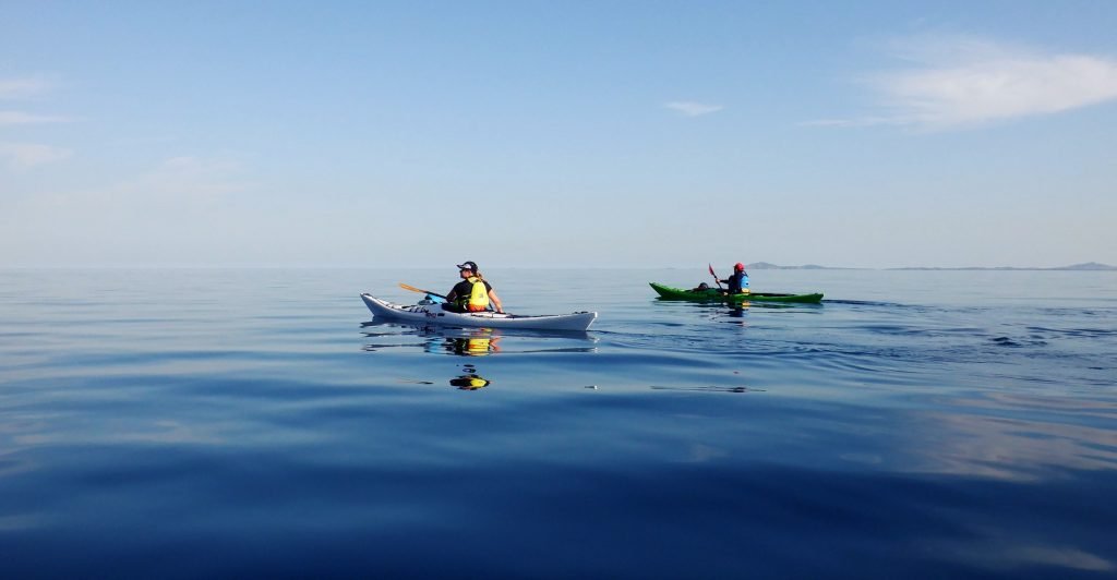 Sea kayakers developing confidence in calm coastal water in Pembrokeshire