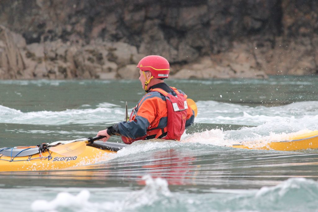 Experienced sea kayakers refining control, judgement and coaching practice on the Pembrokeshire coast